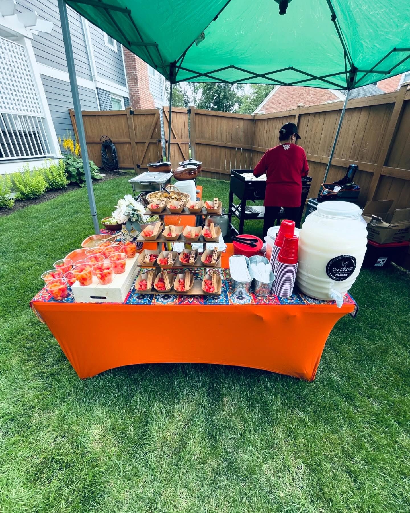 Churros, aguas frescas and fruit setup